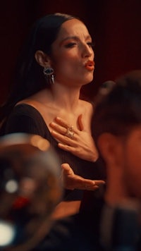 a man and a woman are sitting in a room